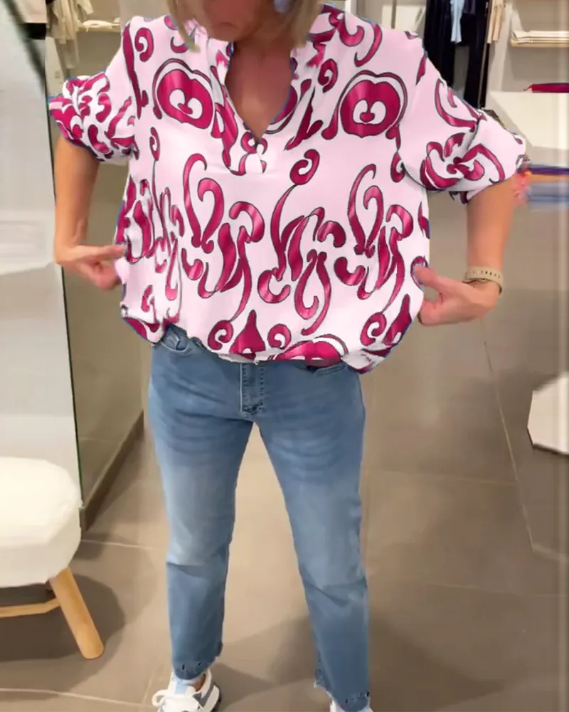Elegant long-sleeved top with printed V-neck