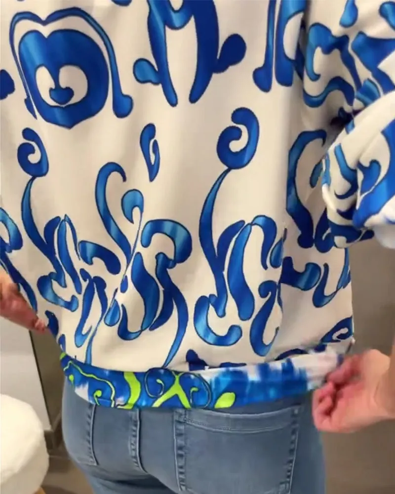 Elegant long-sleeved top with printed V-neck