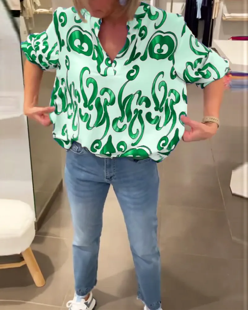 Elegant long-sleeved top with printed V-neck